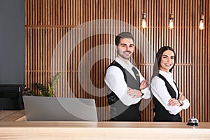 Smiling receptionists at desk