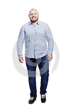 Smiling red-haired fat man with a beard. Body positive. Full height. Isolated on a white background. Vertical