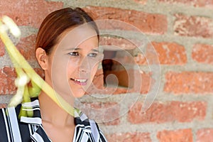 Smiling relaxed young woman glancing sideways