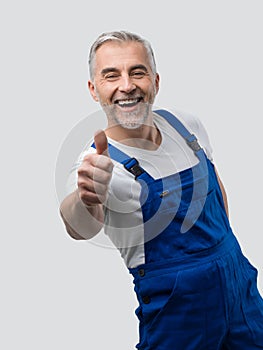 Smiling repairman giving a thumbs up
