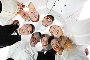 Smiling Restaurant Staff Standing Against White Background photo