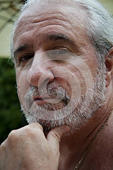 smiling retired old man with graying beard