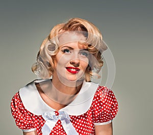 Smiling retro blonde pinup woman