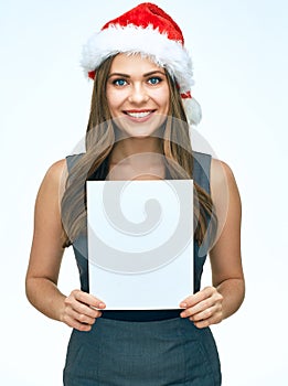 Smiling Santa girl business woman holding white blank advertising banner.