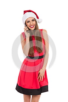 Smiling santa girl on the phone