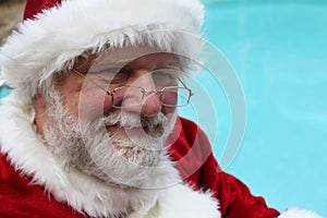 Smiling Santa By a Pool