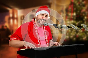 Smiling Santa singing Christmas songs