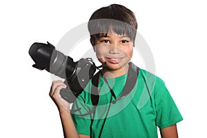 Smiling school boy photographer with DSLR camera