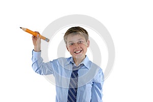 Smiling schoolboy holding a pencil