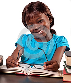 Smiling schoolgirl studying