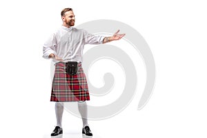 Smiling Scottish redhead man in red photo