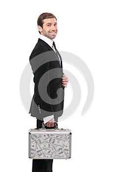 Smiling securuty guard whith a metal suitcase with USD dollars photo