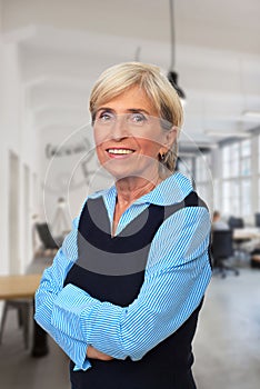 Smiling senior with arms folded posing commercial