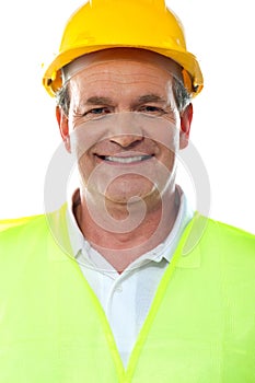 Smiling senior builder wearing hardhat