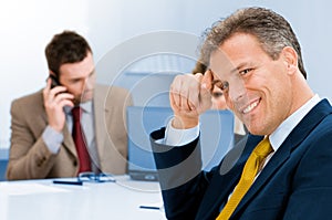 Smiling senior businessman in office