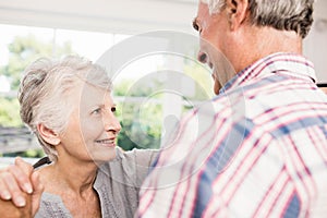 Smiling senior couple dancing