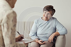 senior female talking to a therapist photo