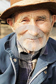 Smiling senior man in hat