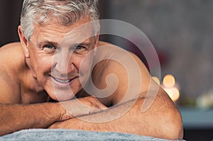 Smiling senior man at spa