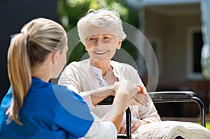 Nurse takes care of old patient photo