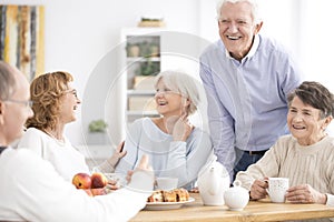 Smiling senior people enjoying meeting photo