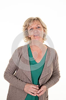 Smiling senior woman blonde mature in sweater and beige cardigan on white background