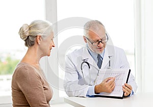 Smiling senior woman and doctor meeting