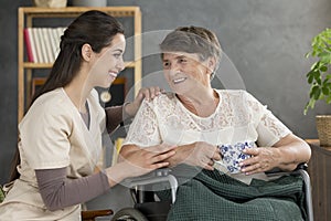 Smiling senior woman drinking tea