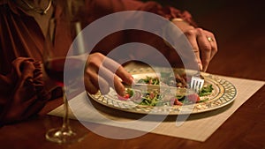 Smiling senior woman eating food at home. Closeup lady enjoy delicious meal