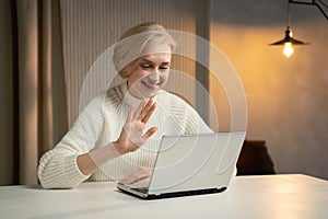 Smiling Senior Woman Engaging in a Pleasant Video Call at Home