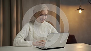 Smiling Senior Woman Engaging in a Pleasant Video Call at Home