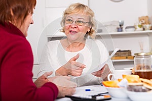 Smiling senior women with documentation