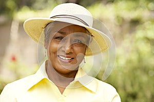 Smiling Senior Woman In Garden