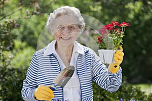 Smiling Senior Woman Holding Flowers