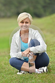 Smiling senior woman relxing outdoors