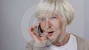 Smiling senior woman talking phone, family care, happy relationship, close-up