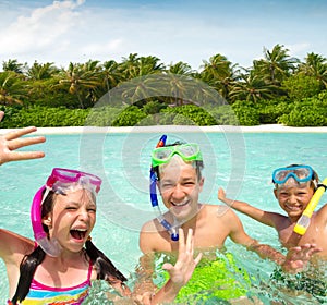 Smiling siblings swimming