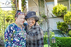 Smiling sisters in the garden