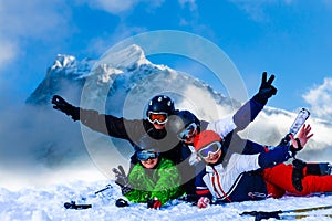 Smiling ski friends skiing alps resort