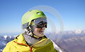 Smiling Skier with Reflective Goggles and Helmet