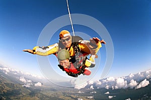 Smiling skydivers mid air photo