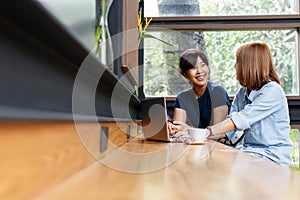 Smiling small business owners woman discussing ideas for project photo