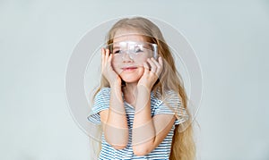 Smiling small girl wears safety goggles.