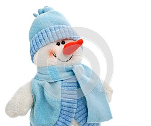 Smiling snowman toy dressed in scarf and cap