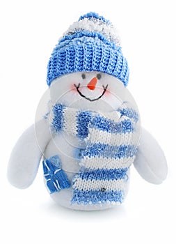 Smiling snowman toy dressed in scarf and cap