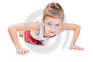 Smiling sport child boy press up exercising