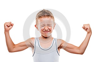 Smiling sport child boy showing hand biceps muscles strength