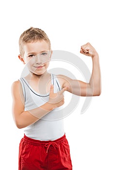 Smiling sport child boy showing hand biceps muscles strength