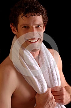 Smiling sportsman with towel