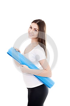 Smiling sporty girl with yoga mat